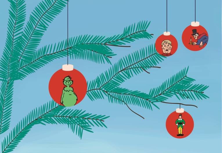 Zu sehen ist ein Tannenzweig vor hellblauem Hintergrund, an dem rote Kugeln hängen.